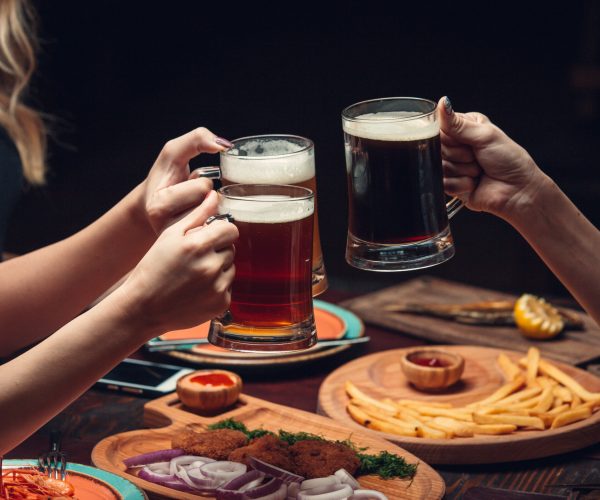 two-women-dinner-table-with-beer-glasses